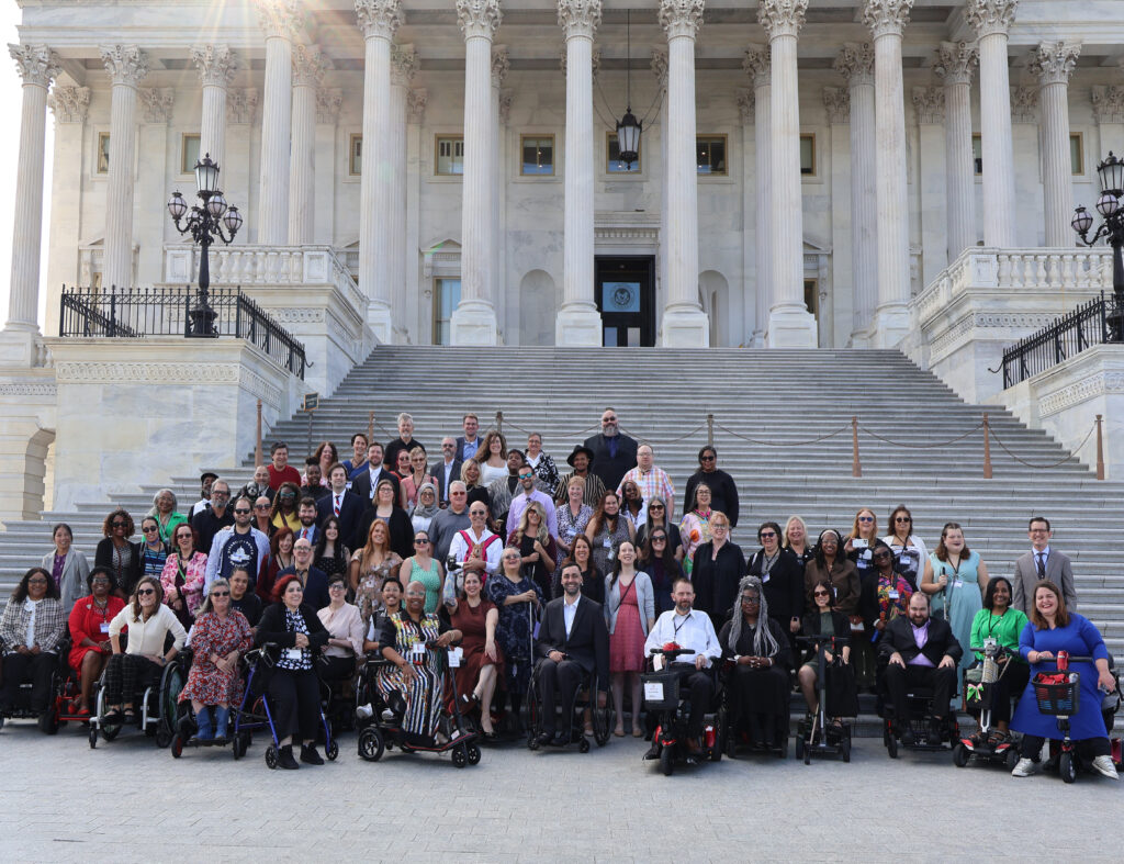 AAPD and friends of AAPD pose for a photo in front of the US Capitol
